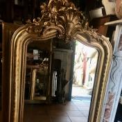 GILDED MIRROR WITH CARVED MOLDING